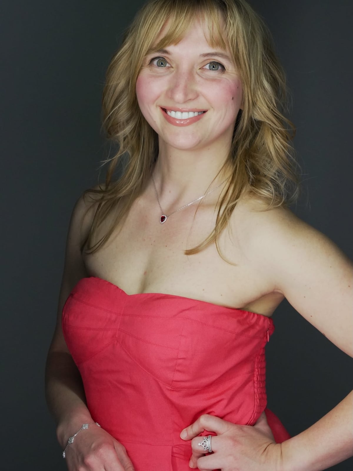 Portrait of Iryna Viriasova in a red evening dress.